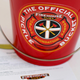 Red pickle bucket from Firehouse Subs on white background